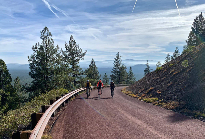 Cresting the peak on the Water and Lava ride on the Cascades Gravel Scenic bikeway near Bend, OR