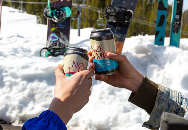 Two people cheers nonalcoholic beers in Bend, Oregon.
